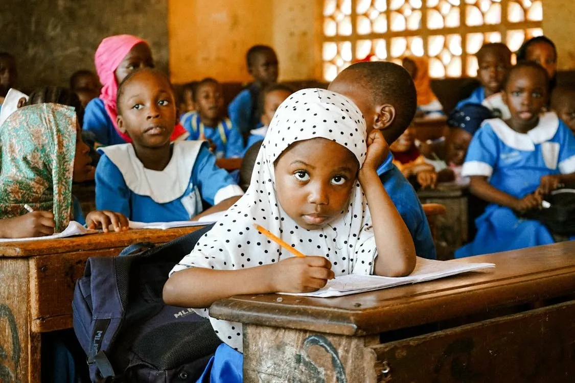 Student focused on learning in a Nigerian classroom